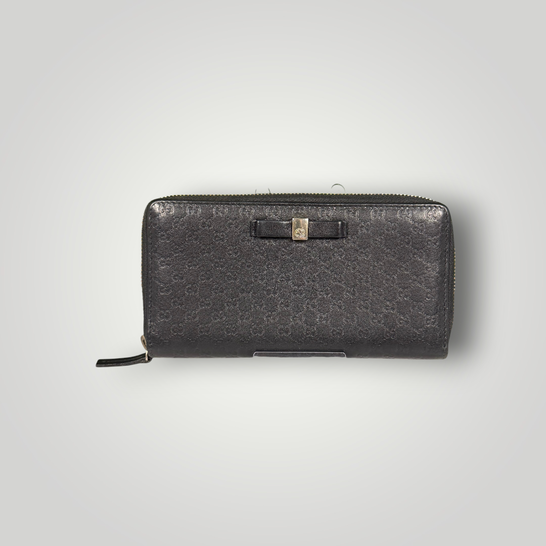 Gucci Pre-Loved Guccissima Bowtie Zippy Wallet