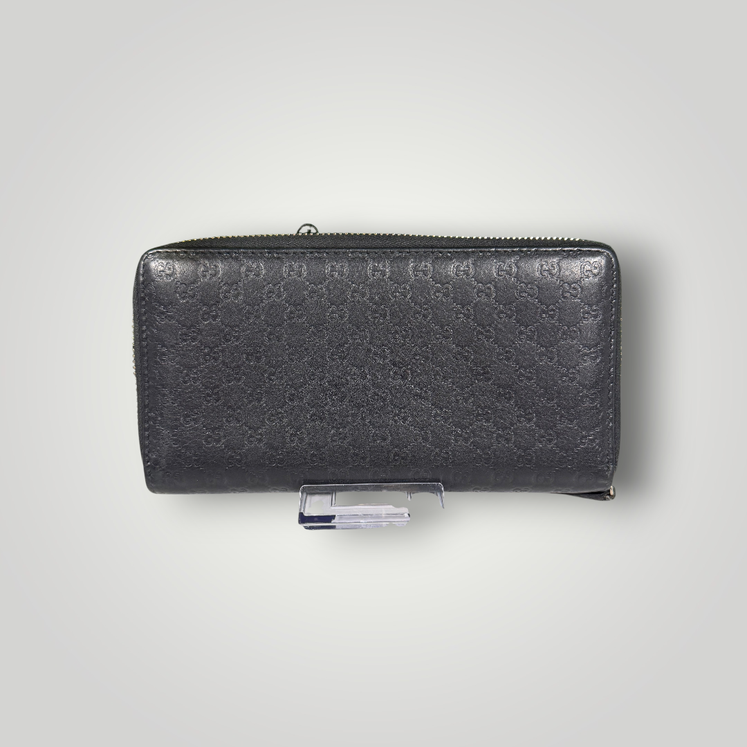 Gucci Pre-Loved Guccissima Bowtie Zippy Wallet