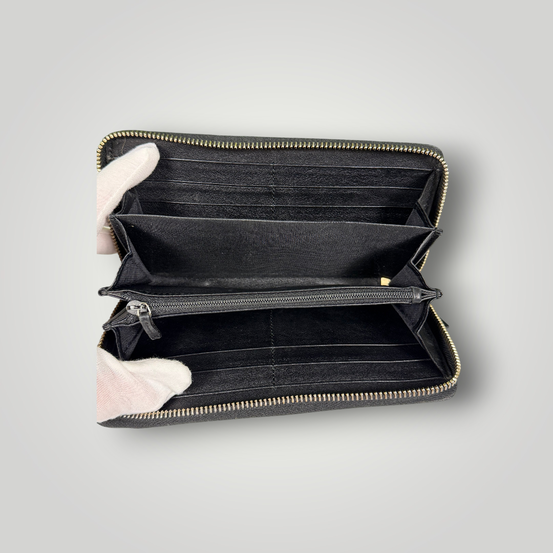 Gucci Pre-Loved Guccissima Bowtie Zippy Wallet